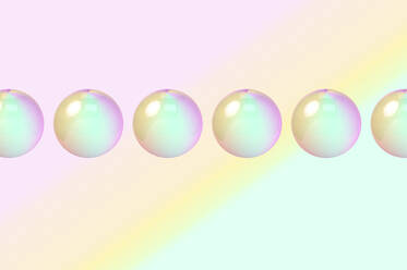 Three dimensional render of row of bubbles against colorful background - GEMF04738