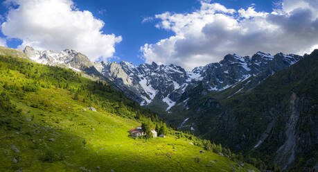 Ancient group of huts illuminated by sun, Val d'Arigna, Valtellina, Orobie Alps, Lombardy, Italy, Europe - RHPLF19438