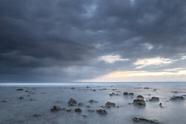 Long exposure of a storm approaching the Gili islands, Lombok, Indonesia, Southeast Asia, Asia - RHPLF19475