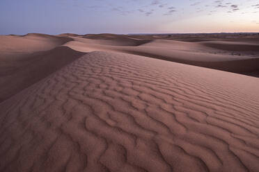 Blue hour on the Sahara Desert sand dune patterns, Erg Chebbi, Merzouga, Morocco, North Africa, Africa - RHPLF19478