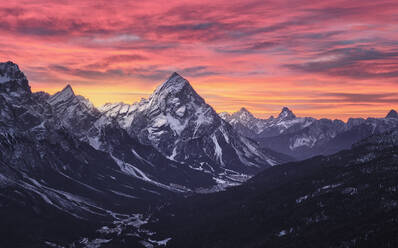 Pink sunrise on Antelao and Cortina d'Ampezzo valley in winter with snow, Dolomites, Trentino-Alto Adige, Italy, Europe - RHPLF19494