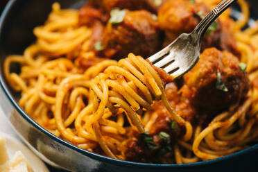 Spaghetti spun onto a fork closeup - CAVF93892