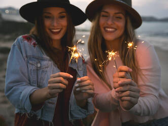 Girls Celebrating friendship on the beach - CAVF93903