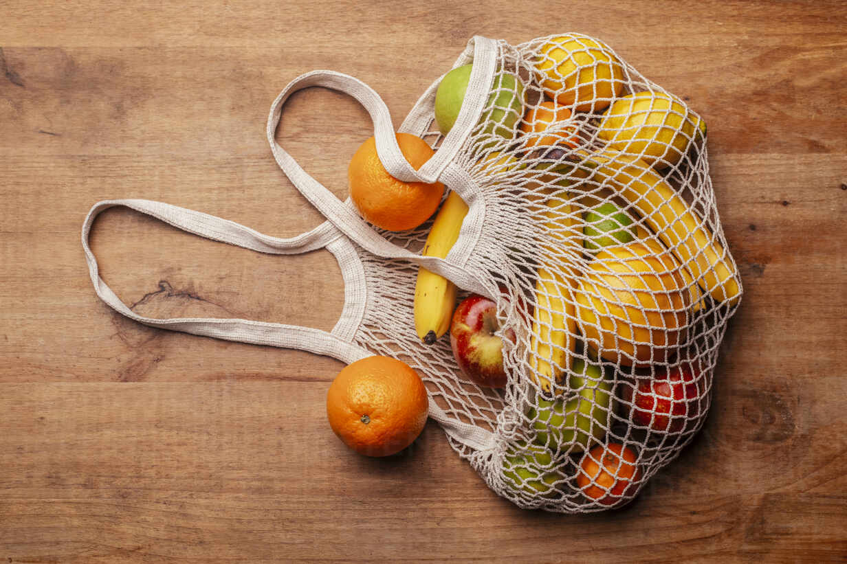 Fresh citruses in string bag · Free Stock Photo