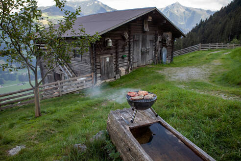 Barbecue grill outside wooden hut at Mayrhofen, Zillertal, Austria - GAF00183