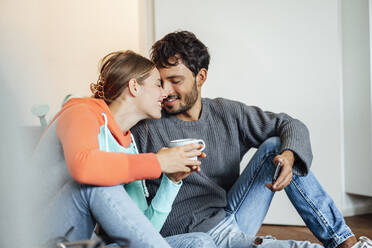 Romantic couple sitting together at home - JOSEF04035