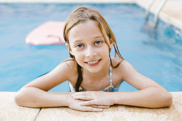 Smiling girl at poolside - AGGF00097