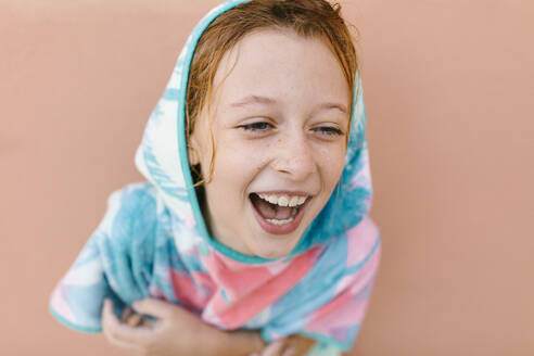 Cheerful girl in bathrobe looking away - AGGF00101