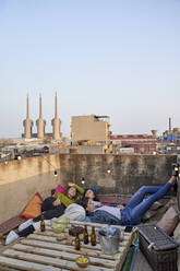 Female friends relaxing on rooftop - VEGF04292