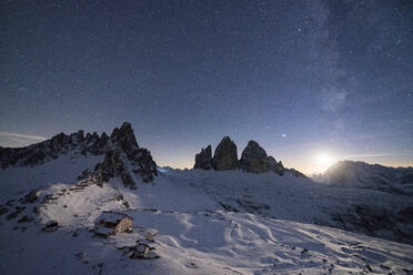 Monte Paterno, Tre Cime di Lavaredo and Rifugio Locatelli hut lit by moon, Sesto Dolomites, South Tyrol, Italy, Europe - RHPLF19620