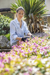 Woman working in garden - WPEF04323