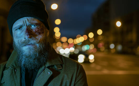 Hipster man with beard and cinema makeup posing on the street - ADSF23220