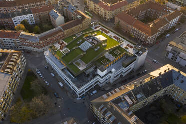 Sweden, Scania, Malmo, Aerial view of rooftop lawn in middle of residential city district - TAMF02934