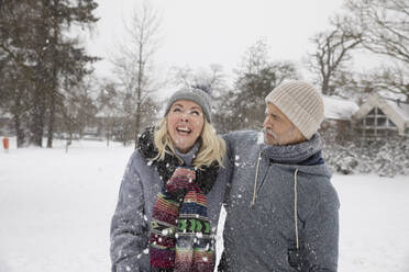 Man and woman enjoying in snow during winter - FVDF00085
