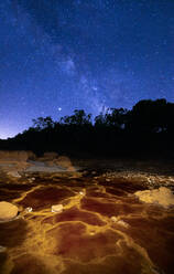 Breathtaking scenery of river in highlands under starry sky in Minas de Rio tinto in long exposure - ADSF23494