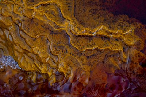 Majestic view of orange rock in river with fast flow in long exposure in Minas de Rio tinto - ADSF23495