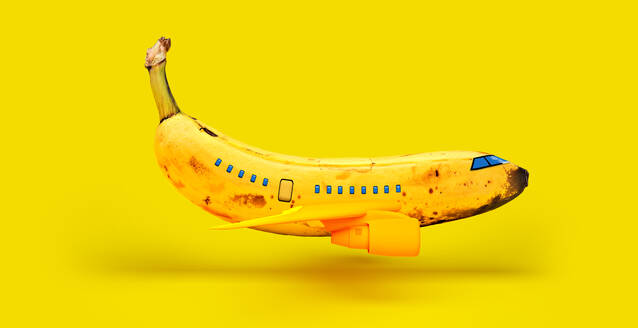 Banana representing airplane against yellow background - VTF00635