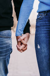 Girlfriend and boyfriend holding hands - EBBF03426