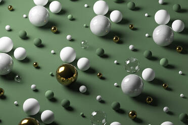 Gold, glass, marble spheres against pastel green background - JPSF00146