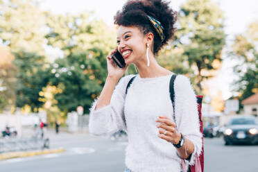 Young woman on phone outdoors - ISF24468