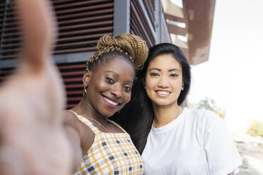 Happy female friends smiling outdoors - JCCMF02246