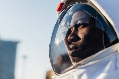 Thoughtful astronaut looking away - MEUF02715