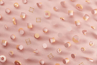 Three dimensional pattern of spheres, cones, rings, cubes and cylinders floating against pink background - JPSF00160