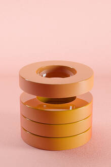 Dreidimensionales Rendering eines Stapels orange glänzender Ringe - JPSF00171