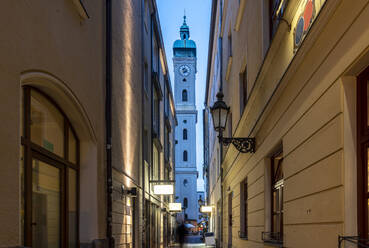 Alley by tower of Heiliggeistkirche catholic gothic church at Munich, Bavaria, Germany - TAMF02948