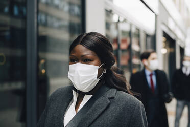 Female entrepreneur looking away during pandemic - MASF23332