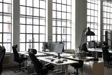 Interior of office with computers on desks - MASF23347