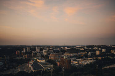 High angle view of city against sky during sunset - MASF23365