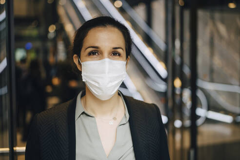 Portrait of female entrepreneur at subway station during COVID-19 - MASF23549