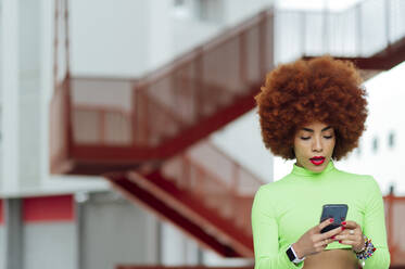 Afro woman using mobile phone  - PGF00569