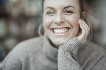 Beautiful woman with toothy smile at cafe - JOSEF04392