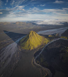 Amazing peaceful view of rough hilly terrain covered with lush verdant greenery in Icelandic countryside - ADSF24231