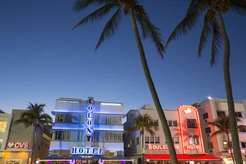 Colourful hotel facades illuminated by night, Ocean Drive, Art Deco Historic District, South Beach, Miami Beach, Florida, United States of America, North America - RHPLF19777