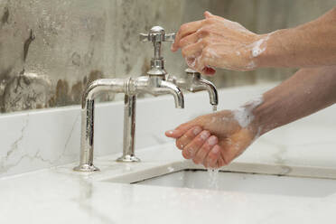 Person washing hands - CUF57941