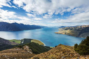 Scenic view of clouds over Lake Hawea and surrounding mountains - WVF01851