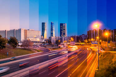 Contemporary skyscraper and multistory house exteriors against roadway and shiny light posts in Madrid at sunset - ADSF24447