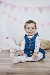 Smiling girl in decorated room at home - EBBF03480