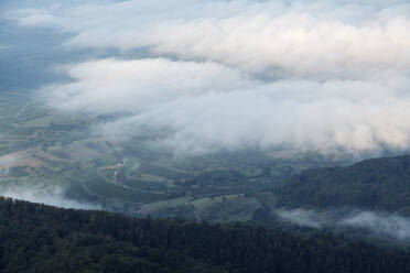 Clouds floating over valley seen from top of Hochblauen mountain - RUEF03329