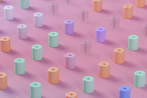 Dreidimensionales Muster aus pastellfarbenen Zylindern vor rosa Hintergrund - JPSF00223