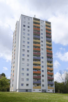 Germany, North Rhine-Westphalia, Hagen, High-rise apartment building with colorful balconies - WIF04410