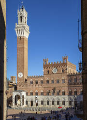 Italy, Tuscany, Siena, Clear sky over Palazzo Pubblico and Torre del Mangia - MAMF01840