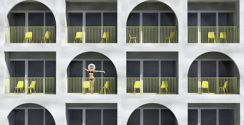 Woman wearing bikini standing in balcony of hotel during vacation - VTF00642