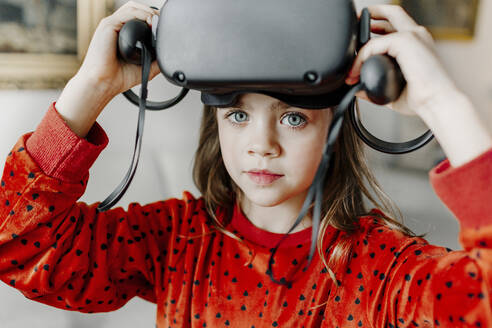 Cute girl wearing virtual reality simulator - OGF01031