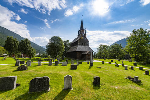 Kaupanger Stave Church amidst cemetries at Kaupanger, Vestland, Norway  - RUNF04486