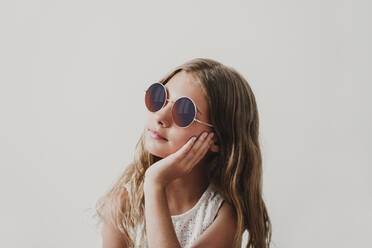 Young mixed race girl wearing sunglasses stock photo