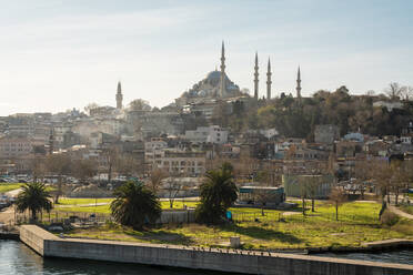 Turkey, Istanbul, Waterfront park with Rustem Pasha and Suleymaniye mosques in background - TAMF03045